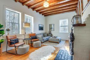 a living room with a couch and chairs at Charming Jaffrey Cottage with Deck and Grill! in Jaffrey