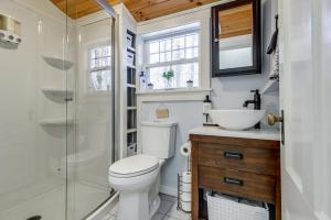 a bathroom with a toilet and a sink and a shower at Charming Jaffrey Cottage with Deck and Grill! in Jaffrey +33 photos