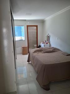 En eller flere senge i et værelse på Casa espaçosa e aconchegante