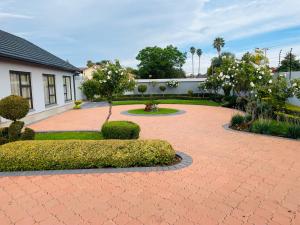 a brick walkway in front of a house at Loreho boutique in Mahikeng