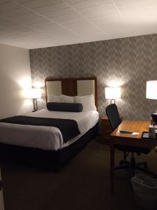 Ένα ή περισσότερα κρεβάτια σε δωμάτιο στο The Lodge at Wisp