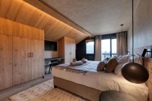 En eller flere senge i et værelse på Pontirolo Nuovo Chalet Zermatt