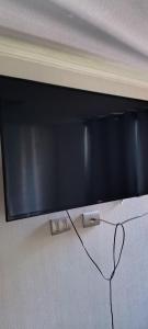 TV a/nebo společenská místnost v ubytování Lindos Departamentos amoblado en Santiago centro