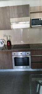 Kuchyň nebo kuchyňský kout v ubytování Lindos Departamentos amoblado en Santiago centro