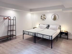 En eller flere senge i et værelse på Casa Katalina Filderstadt,!!!Aktuell nur 1 Schlafzimmer!!!, top für Familien und Geschäftsreisen, super ausgestattet, mit PKW Stellplatz