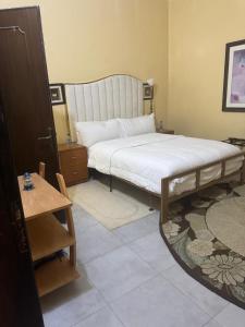 En eller flere senge i et værelse på Ô bien être