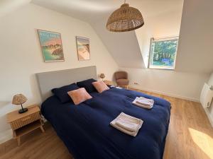 En eller flere senge i et værelse på Les Pierres 2 Loc Amand