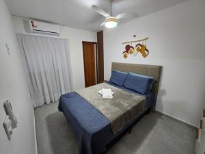 Postel nebo postele na pokoji v ubytování Casa Pérola de Marataízes 40 metros da praia