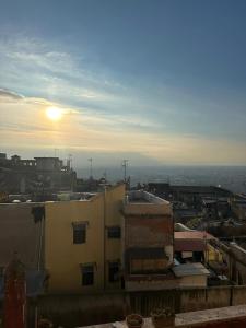 a view of a city with the sun in the sky at L'Abbraccio in Tivoli