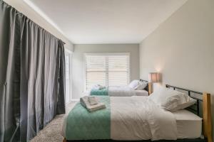 Ένα ή περισσότερα κρεβάτια σε δωμάτιο στο Central Melb Accessible 5bd 3ba Pool Sleeps 14 +54 φωτογραφίες