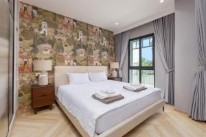 Giường trong phòng chung tại Evora 1BR Suite — The Title Legendary BangTao +46 ảnh