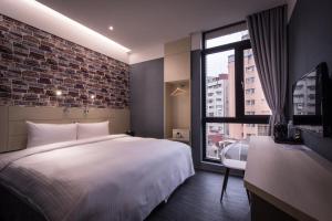 Postel nebo postele na pokoji v ubytování Yi Su Hotel-Taipei Ningxia + 37 fotografií