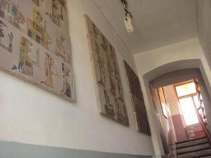 a hallway with three pictures on the wall and a window at Apartment Kunst Asyl by Interhome in Quedlinburg