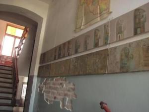 a wall with pictures on the wall of a building at Apartment Kunst Asyl by Interhome in Quedlinburg