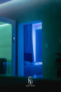 En eller flere senge i et værelse på Épure Ivoire Wellness