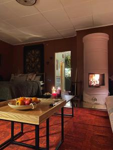 a living room with a table with fruit on it at Atelier Torppa in Rovaniemi