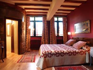 En eller flere senge i et værelse på Hotel Castillo el Collado