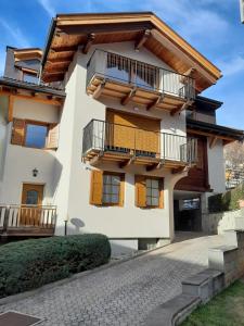 a house with balconies on the side of it at Casa Zena in Tesero