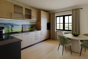 une cuisine avec des armoires blanches et une table avec des chaises dans l'établissement Ferienwohnung Jehl am Tegernsee, à Bad Wiessee