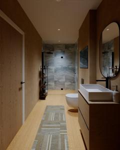 une salle de bains avec baignoire, toilettes et lavabo dans l'établissement Ferienwohnung Jehl am Tegernsee, à Bad Wiessee