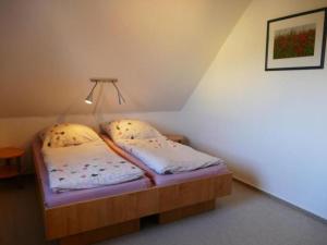 a small room with two beds in a attic at Apartment Schwalbenring by Interhome in Rövershagen