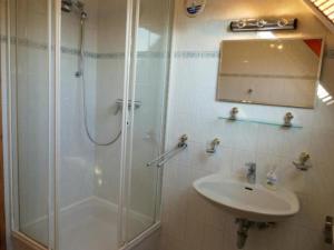 a bathroom with a shower and a sink at Apartment Schwalbenring by Interhome in Rövershagen