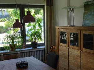 a dining room with a table and a large window at Apartment Jakobs by Interhome in Vlotho