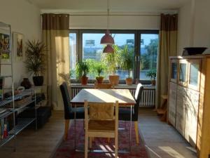 a dining room with a table and chairs and a window at Apartment Jakobs by Interhome in Vlotho +21 photos