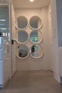 a room with three circular shelves on the wall at Apartment Kleines Loft by Interhome in Gais