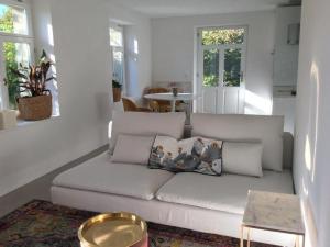 a living room with a couch with pillows on it at Apartment Kleines Loft by Interhome in Gais