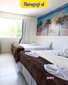 En eller flere senge i et værelse på pousada agua viva