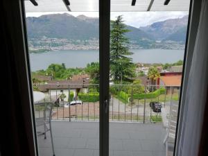 a view of a lake from a window at Apartment Casa Barbara by Interhome in Piazzogna +20 photos
