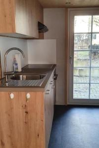 a kitchen with a sink and a window at Apartment GLORIOS by Interhome in Heiden