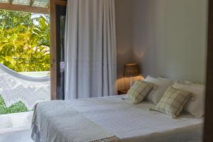 En eller flere senge i et værelse på Pé na Areia