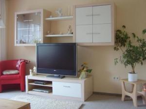 a living room with a tv on a white entertainment center at Apartment im Teutoburger Wald by Interhome in Schieder