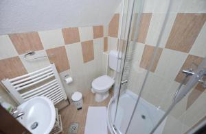 Koupelna v ubytování Apartmani Nikcevic Zabljak + 17 fotografií