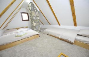 Postel nebo postele na pokoji v ubytování Apartmani Nikcevic Zabljak