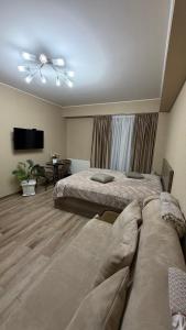 Postel nebo postele na pokoji v ubytování GL Apartment in New Gudauri Block 3