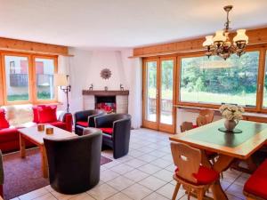 a living room with a couch and a table at Apartment Curtins16 by Interhome in Pontresina