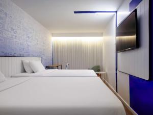 En eller flere senge i et værelse på Novotel Rio de Janeiro Leme