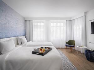 En eller flere senge i et værelse på Novotel Rio de Janeiro Leme