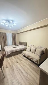 Ένα ή περισσότερα κρεβάτια σε δωμάτιο στο GL Apartment in New Gudauri Block 3