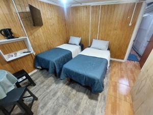 Ένα ή περισσότερα κρεβάτια σε δωμάτιο στο Hostal House FloVer