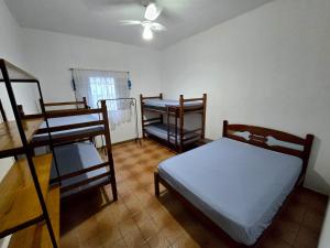 En eller flere senge i et værelse på Casa no Centro 600m da Praia