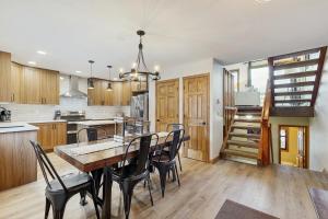 a kitchen and dining room with a table and chairs at Wapiti Townhouse 3 in Fraser