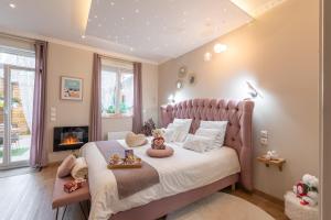 En eller flere senge i et værelse på La bulle romantique