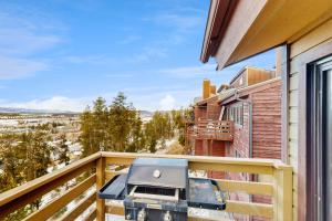 a grill on the balcony of a house at Wapiti Townhouse 3 in Fraser