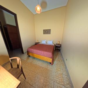 En eller flere senge i et værelse på Casa Tierra Libre