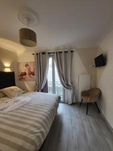 En eller flere senge i et værelse på Remblai des Sables d'Olonne - 2 chambres - parking et piscine + 27 billeder