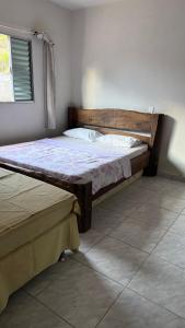 En eller flere senge i et værelse på Casa Califórnia + 9 billeder